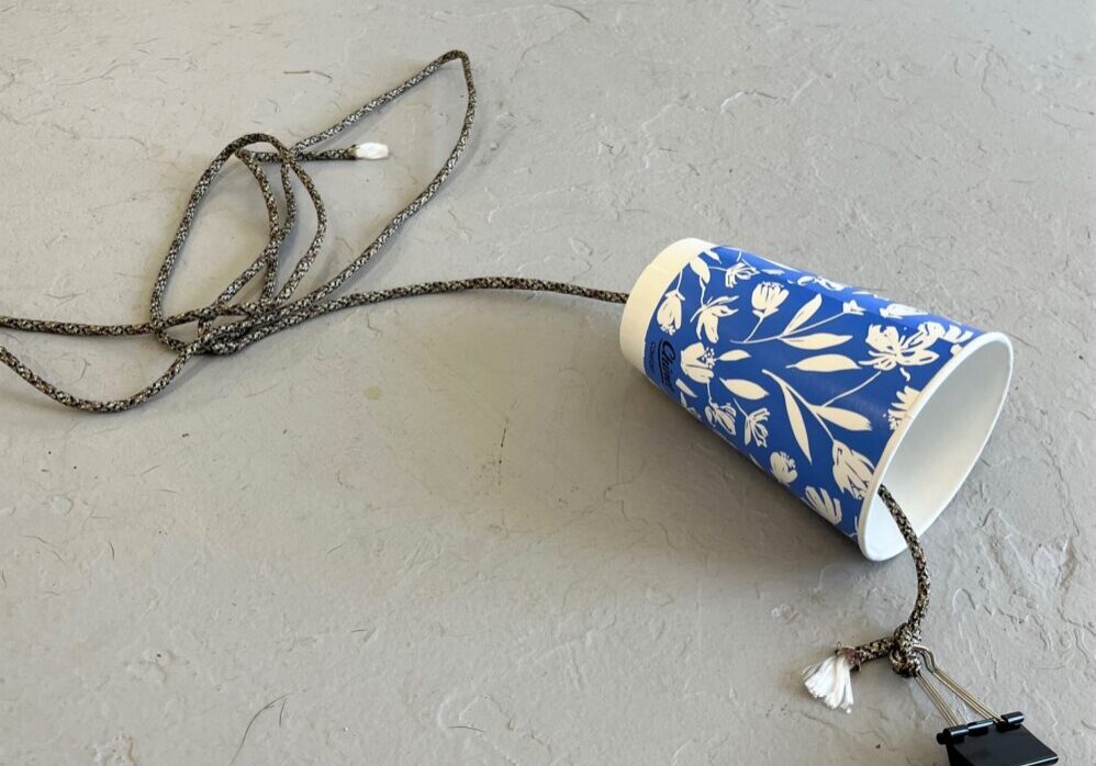hanging cup and a rope on the floor